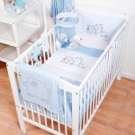 cot bedding sets hello ernest cosi cot 4 piece bedding set in blue on a cot MHDDVCB