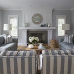 Grey Living Room the house is a gray shingle style home with a gray and white BFWDMEI