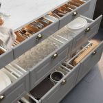 kitchen drawers efficiently holding dishes, in a photo from ikea. KXKFZON