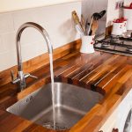 kitchen worktop walnut worktops with an undermounted sink cut-out, drainage grooves and a  tap YULMVYN