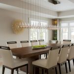 modern dining table this modern dining room space features a long glass chandelier hung over a BJZCXKP