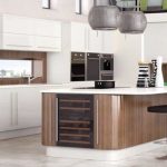 modern fitted kitchen with white cabinets and an island with wine storage CPJJHUW