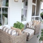 porch furniture love this combo of weathered wicker and grey/white stripes. ballard house  front EICRESI