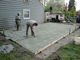 stamped concrete concrete being stamped with an ashlar slate pattern CZLYMRM