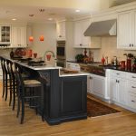 Off White Cabinets with Black Kitchen Island - Deco