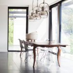 love the mix of industrial / modern with traditional dining table .