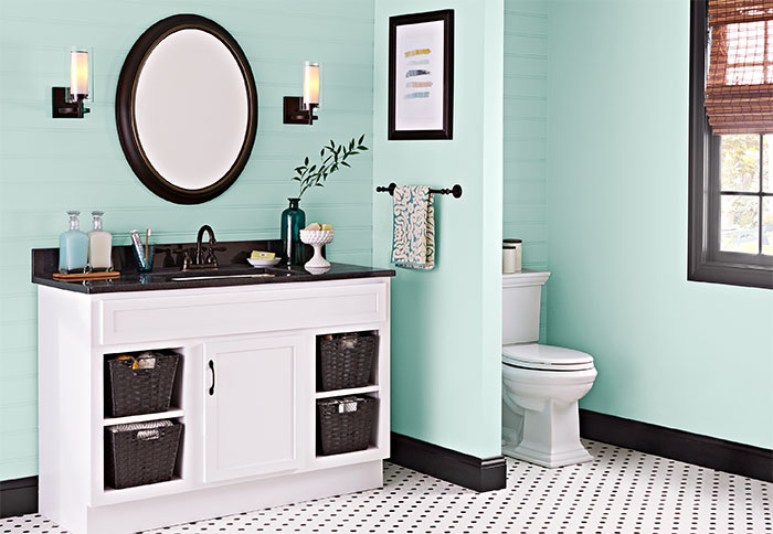 bathroom colors green walls and white-painted vanity EQUGZPP