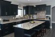 black kitchen cabinets contemporary kitchen with black cabinets, island and giallo verona granite  counters ZNWVBRG