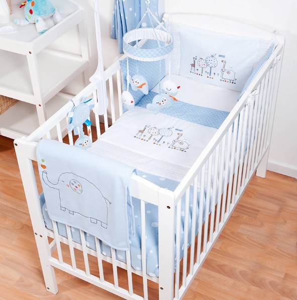 cot bedding sets hello ernest cosi cot 4 piece bedding set in blue on a cot MHDDVCB