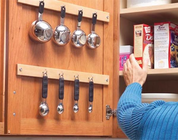 kitchen storage solutions 33. use the inside of your cabinet doors to store smaller utensils. 34 YKUOSIQ