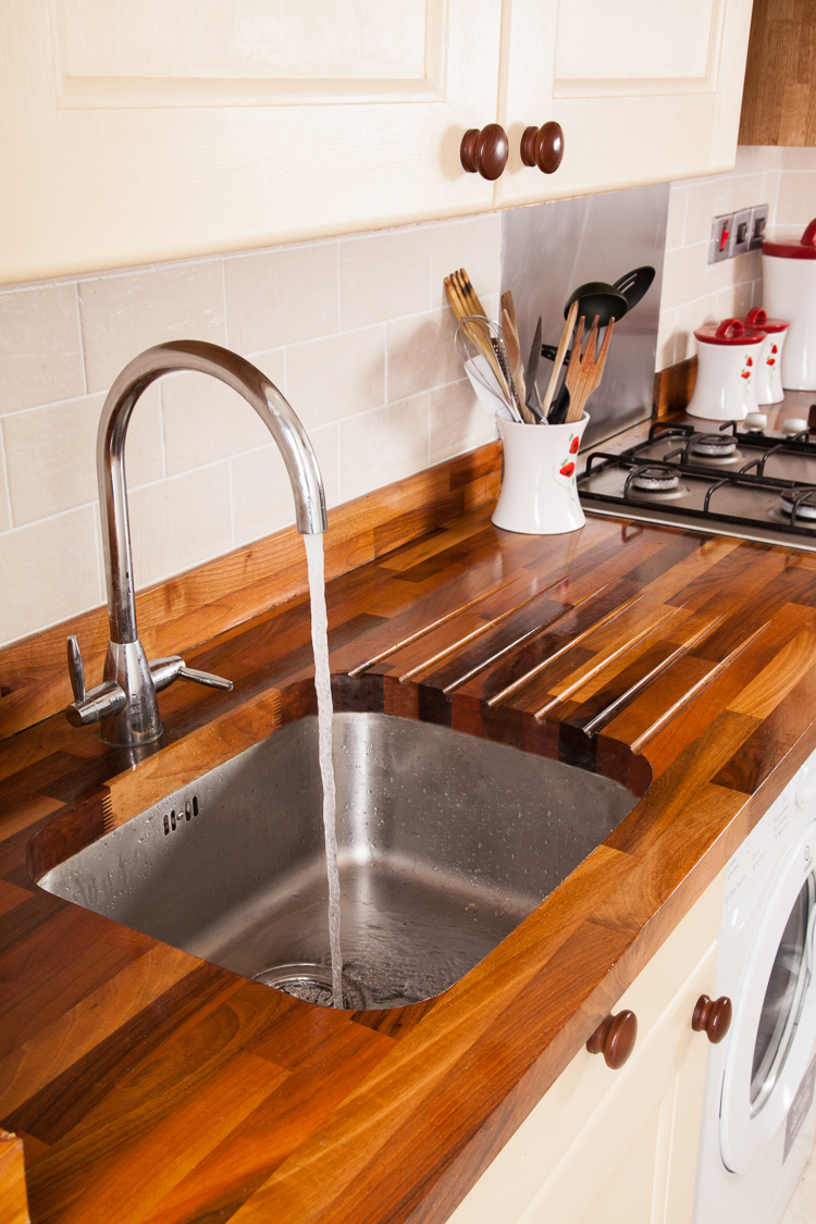 kitchen worktop walnut worktops with an undermounted sink cut-out, drainage grooves and a  tap YULMVYN