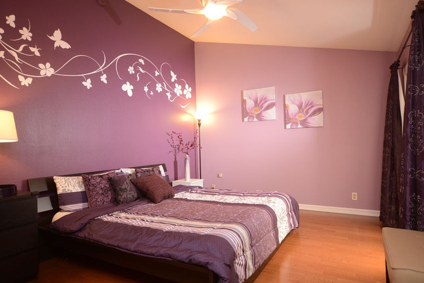 two tone purple bedroom with wall decals and curtains and bed comforter AWGTQXA