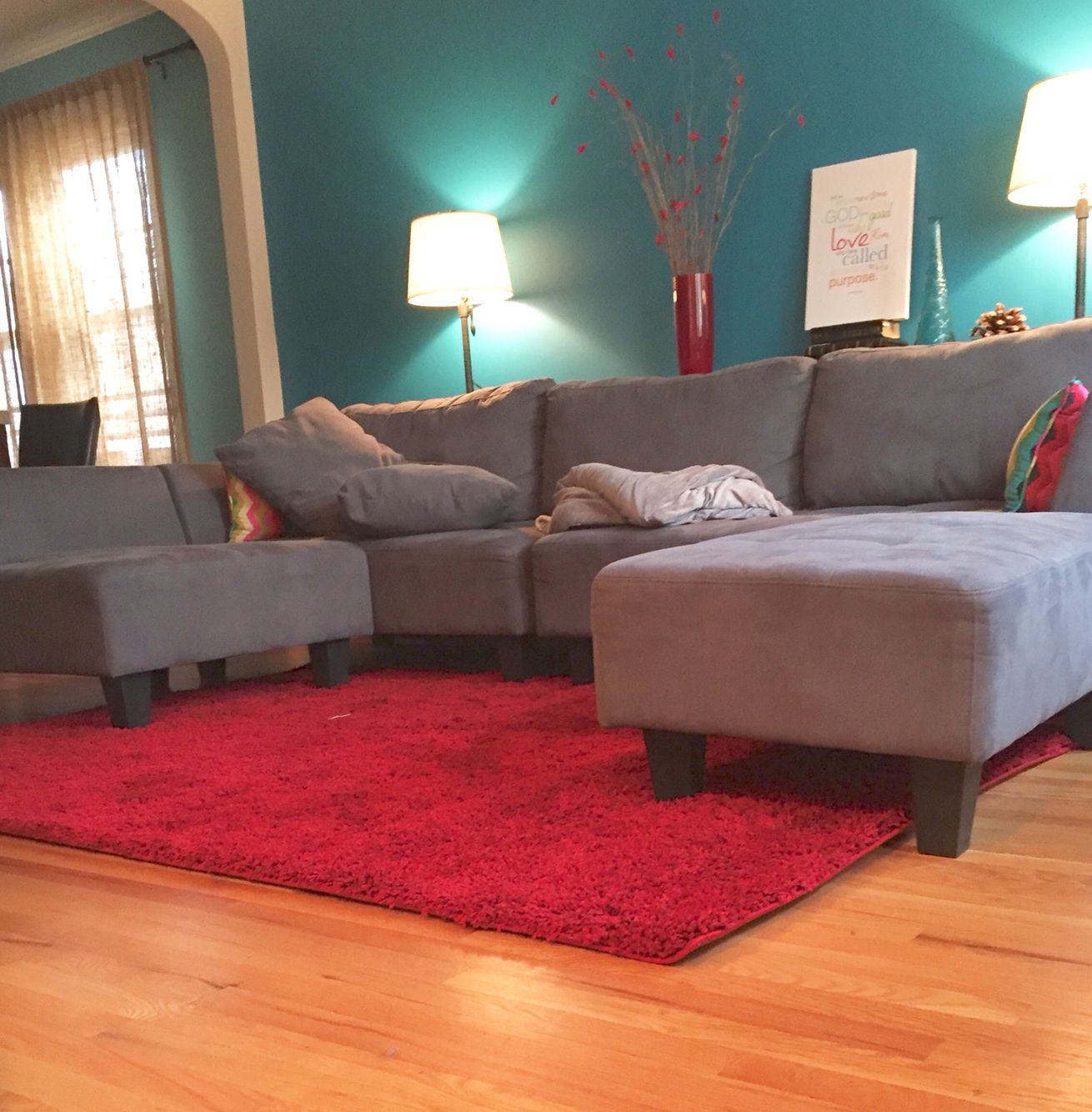 red rugs for living room living room idea: teal blue wall, grey couch, ruby red rug JYNJNBW