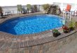 above ground pools that look like in ground aquasport 52 with stones wall and deck IZESHPZ