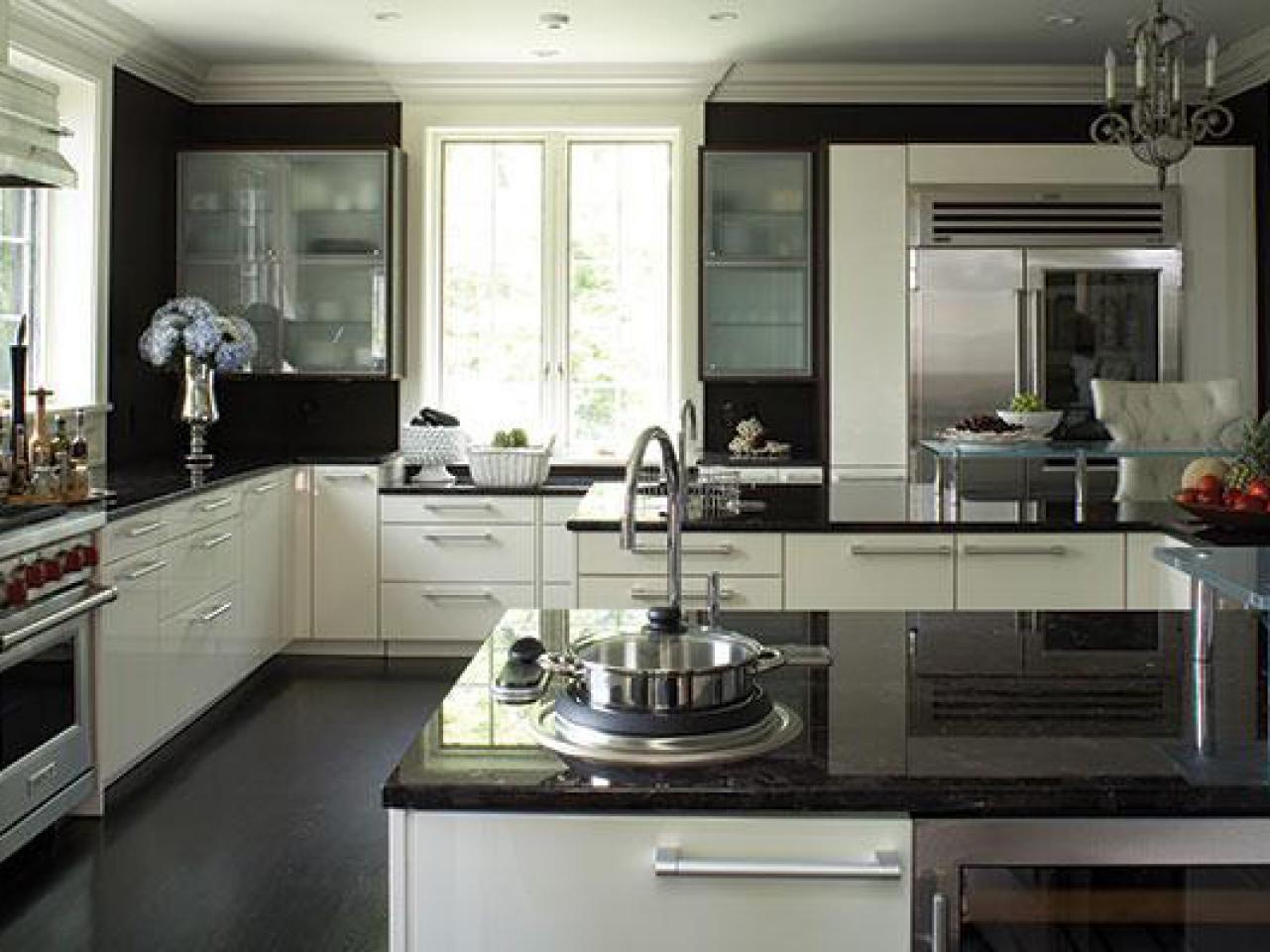 kitchen with white cabinets and black countertops dark granite countertops VOWQRIC