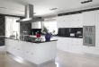 kitchen with white cabinets and black countertops this striking, contemporary kitchen utilizes black counters and bold accent XLLCOBC