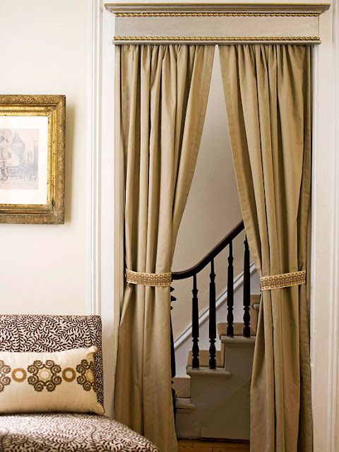 Transform a simple doorway into a pretty passage. Hang curtains in a