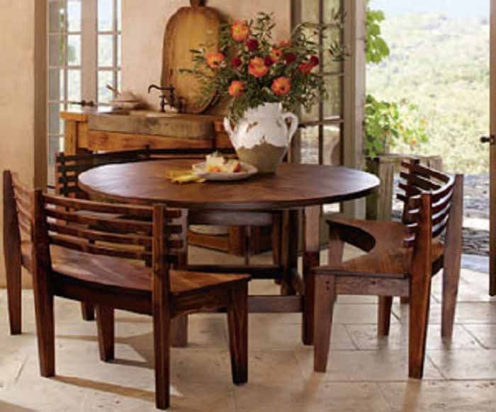 round breakfast table with curved wooden benches | when i wander