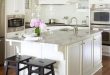 Beautiful white kitchen design with white shaker kitchen cabinets .
