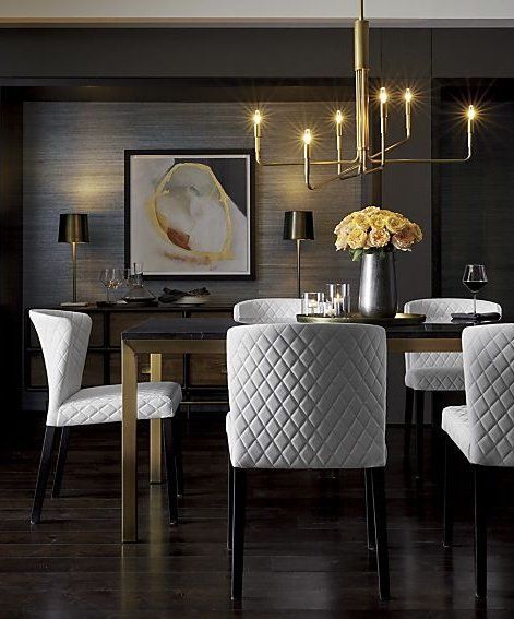 Pair a rich black marble top with a brass bottom for a dining .