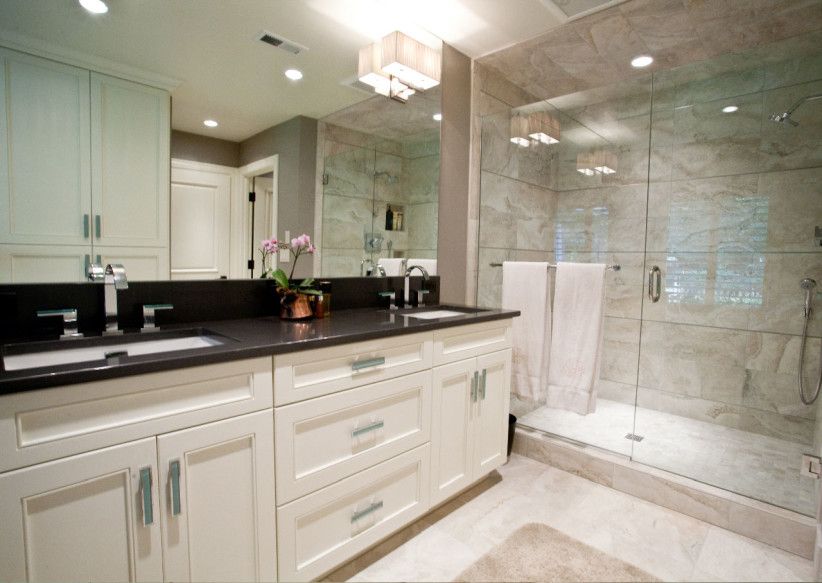 Black granite top over white bathroom vanity | Black vanity .