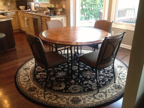 Need help on what shape rug to put under round kitchen table in sma