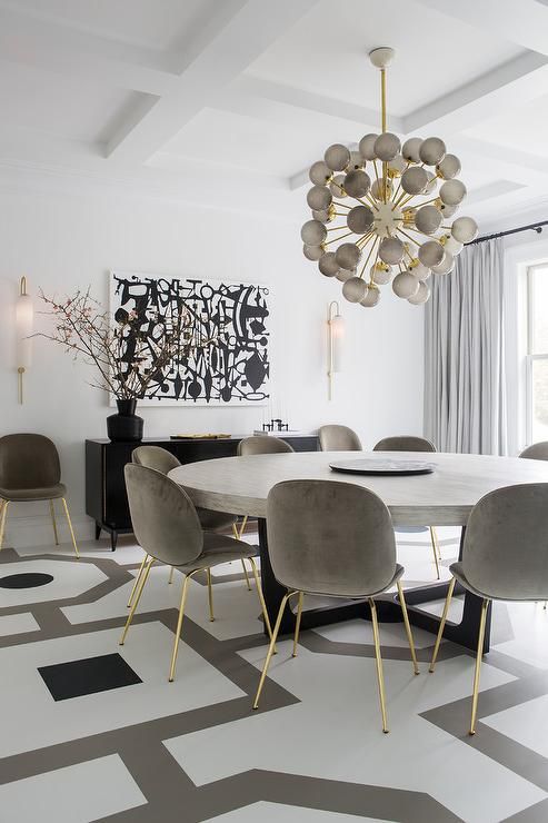 Contemporary white, gray, and black dining room boasts a large .