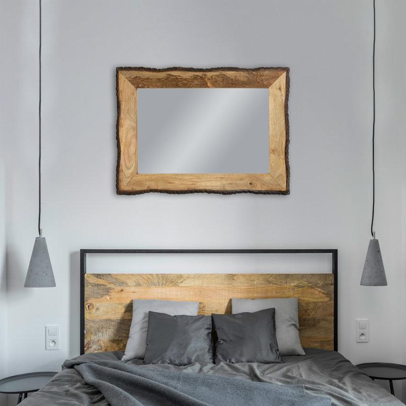 Hang a wooden mirror to create a focal point in design