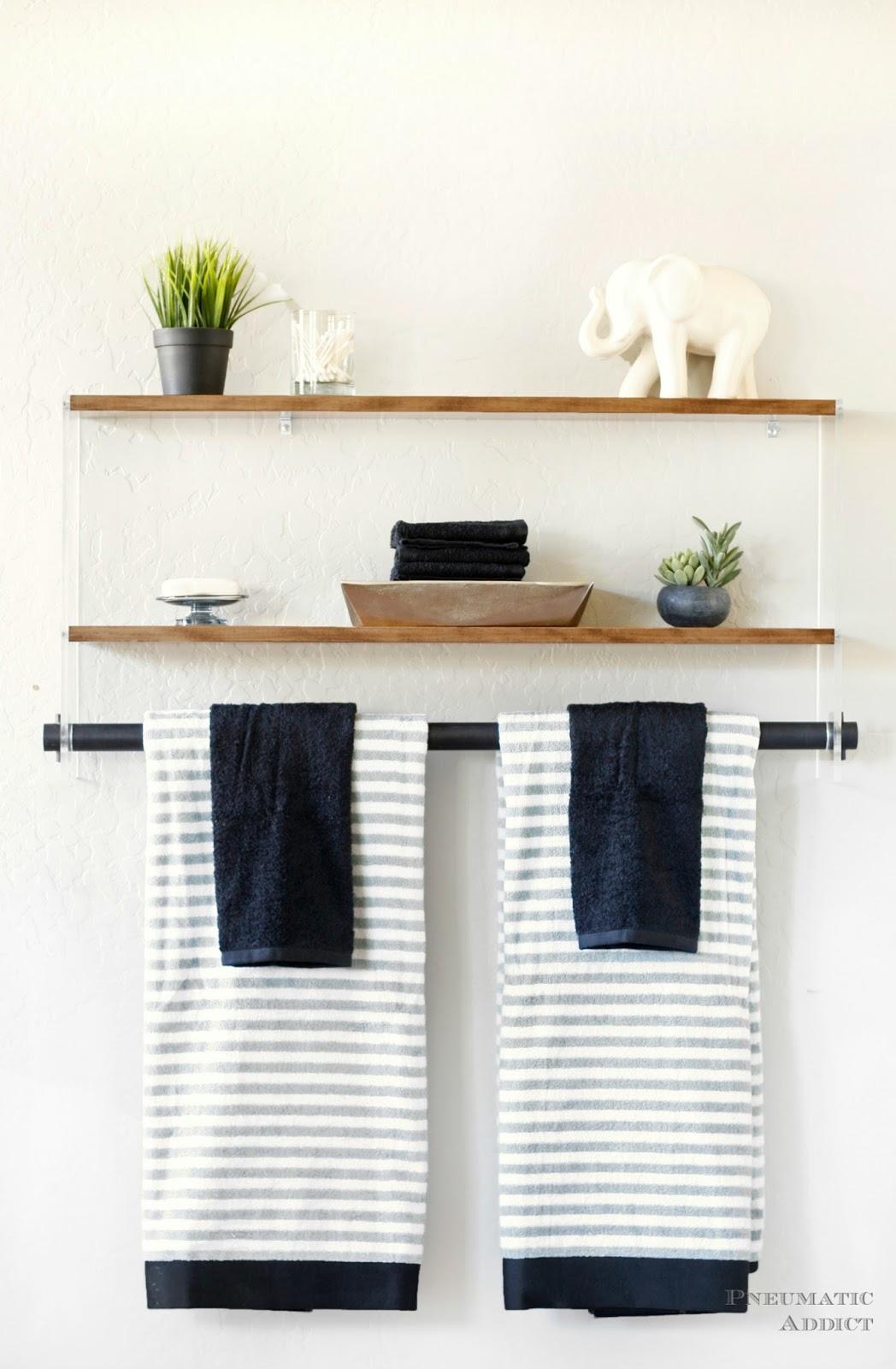 Open wooden bathroom shelving adds depth and character